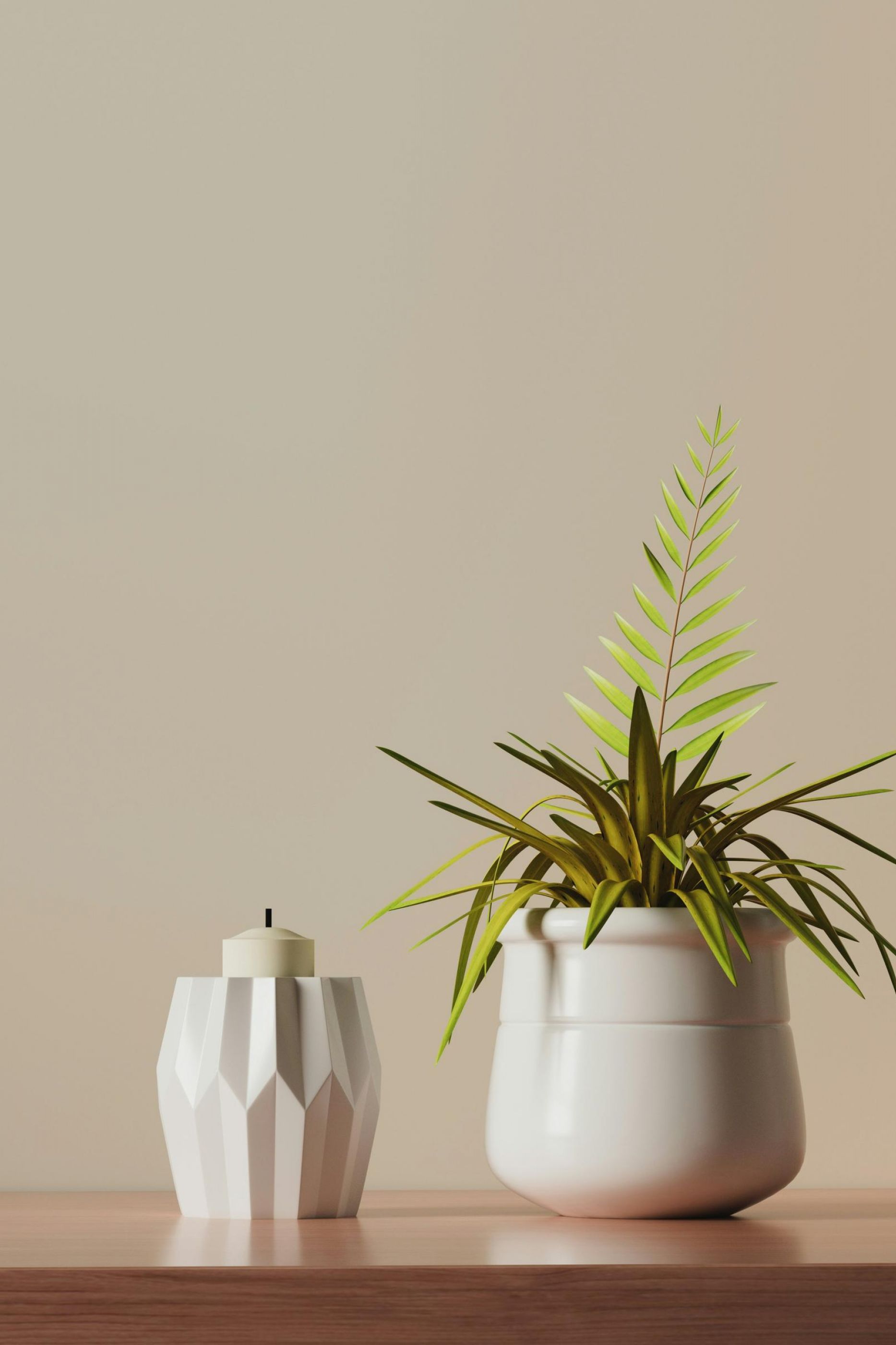 A green plant in a white pot next to a geometric white candle holder on a wooden surface at Northside Vistas apartments.